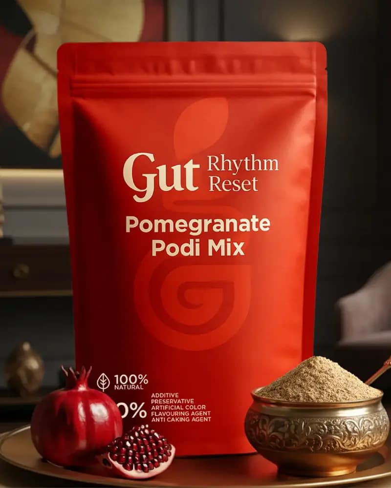 Pomegranate Podi Mix pouch with a brass bowl of podi