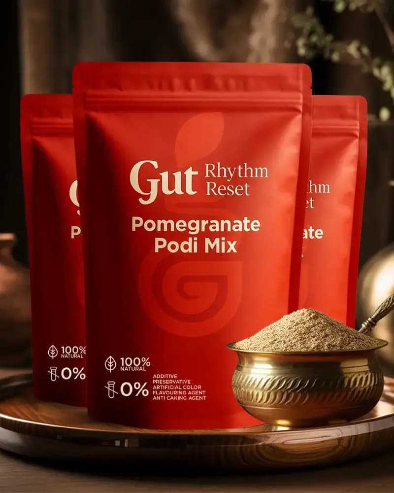 Three Pomegranate Podi Mix pouches with a brass bowl