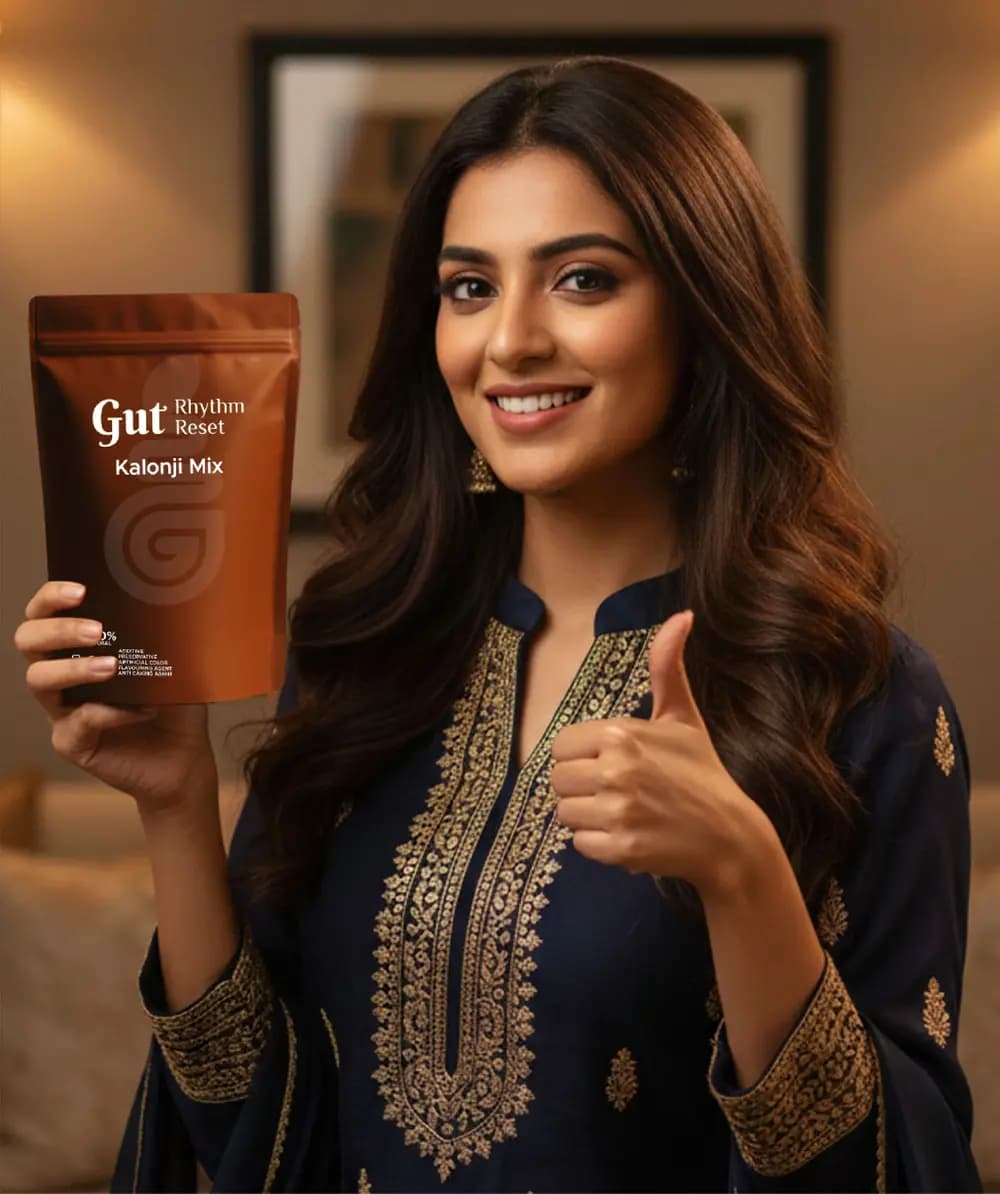 A smiling woman holding a Kalonji Mix pouch with a thumbs up